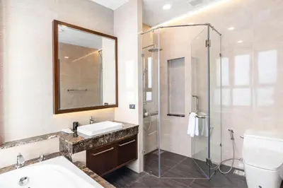 a bathroom with a sink and a shower at ARUN Riverside Bangkok in Bangkok