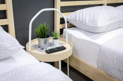 a table with two beds and two plants on it at T1 Large Studio Full kitchen 100m. to BTS in Bangkok