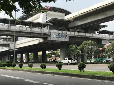 a bridge over a road with a white van driving under it at T5 2 Bedrooms/6guests/full kitchen/1 min to BTS in Bangkok