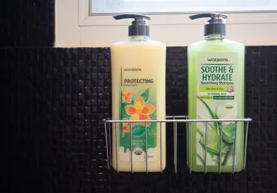 a couple of bottles of soap and a container of shampoo at B2 Large + Comfort full kitchen near MRT Bangson in Bangkok