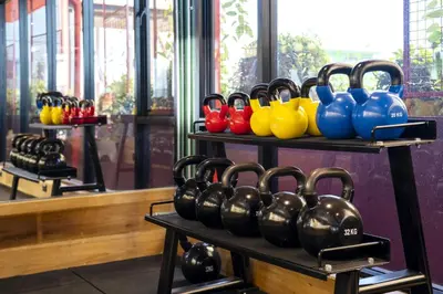 a row of blue and red and yellow boxing gloves at MeStyle Museum Hotel in Bangkok