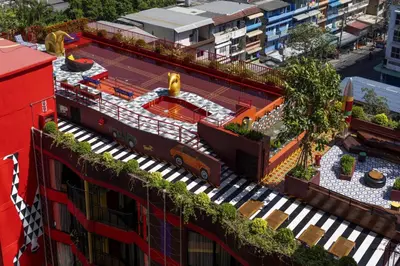 an overhead view of a building with a garden on the roof at MeStyle Museum Hotel in Bangkok
