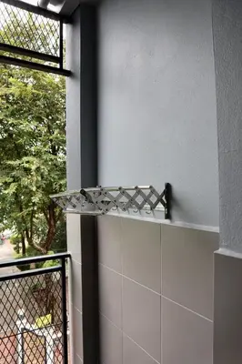 a shelf on a wall with a window at 44 Room Rama 3 in Bangkok