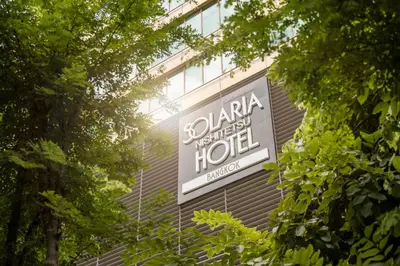 a sign for a hotel on the side of a building at Solaria Nishitetsu Hotel Bangkok in Bangkok
