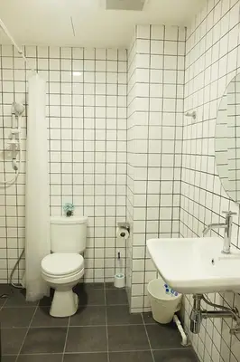 a bathroom with a toilet and a sink at 398 HOSTEL in Bangkok