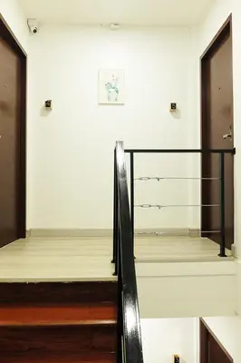 a staircase in a room with a stair case at 398 HOSTEL in Bangkok