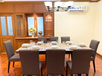 a dining room with a table and chairs at NT Place Sukhumvit Suites in Bangkok