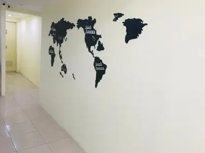 a map of the world on a wall in a hallway at HARRYS RESIENDENCE in Bangkok