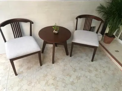 two chairs and a table and a table and chairs at HARRYS RESIENDENCE in Bangkok