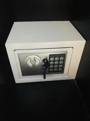 a white microwave with a remote control in it at HARRYS RESIENDENCE in Bangkok
