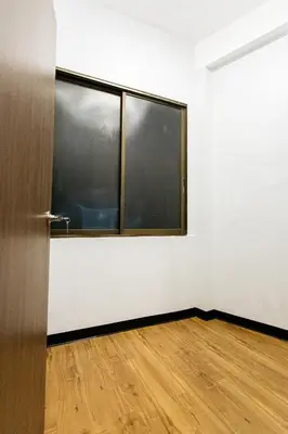 an empty room with a door and a wooden floor at U4 Large 2 bed rooms full kitchen 200m to BTS in Bangkok