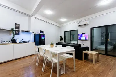 a kitchen and a dining room with a table and chairs at U4 Large 2 bed rooms full kitchen 200m to BTS in Bangkok