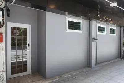 a group of doors on the side of a building at U3 Large 2 Bedroom Full kitchen near BTS Udomsuk in Bangkok