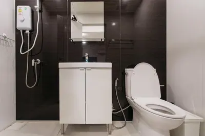a bathroom with a toilet and a shower at U3 Large 2 Bedroom Full kitchen near BTS Udomsuk in Bangkok