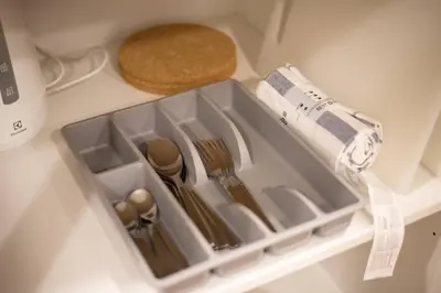 a drawer in a refrigerator filled with utensils at U3 Large 2 Bedroom Full kitchen near BTS Udomsuk in Bangkok