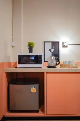 a microwave sitting on top of a counter at Saffron Hill Bangkok in Bangkok