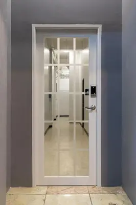 a hallway with a door in a room with a hallway at U1 Large 2 bed rooms BTS Udomsuk in Bangkok