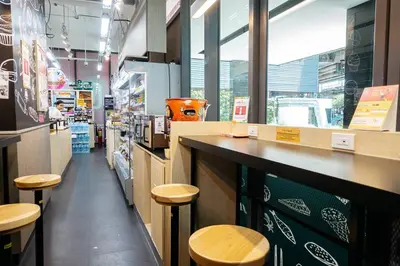 a restaurant with a counter and stools in a store at B3 Cosy Studio /5 guests/ Near MRT/full kitchen in Bangkok