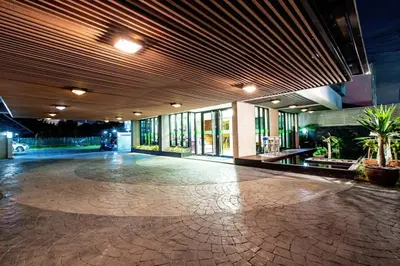 an empty lobby of a building with a large floor at D Day Suite in Bangkok
