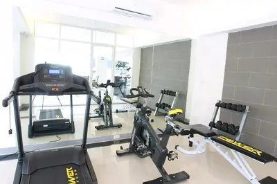 a gym with several treadmills and a treadmill at Lee Garden Bangkok in Bangkok