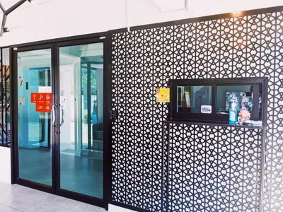a building with glass doors and a wall at Star Sukhumvit in Bangkok