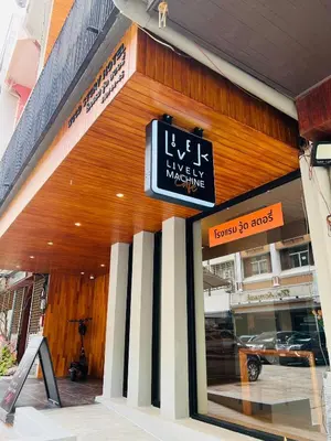 a store with a sign on the front of a building at Woodstory Boutique Hotel in Bangkok