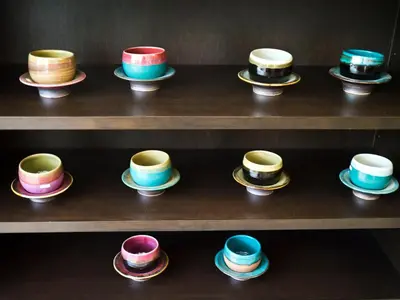 a bunch of hats sitting on a shelf at G9bangkok in Bangkok