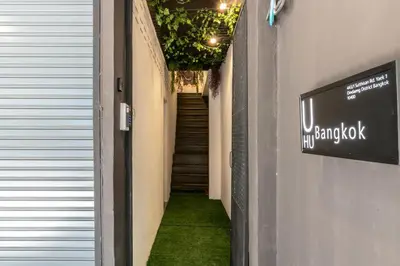 a hallway with a stairway leading up to a building at UHU Bangkok in Bangkok