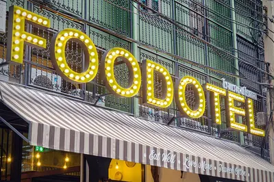 a large sign for a hotel on the side of a building at FOODOTEL in Bangkok