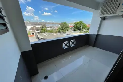 an empty room with a view from a balcony at Sakun Place in Bangna
