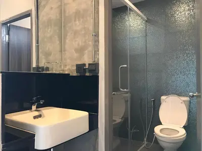 a bathroom with a sink and a toilet and a shower at S1hostel Bangkok in Bangkok