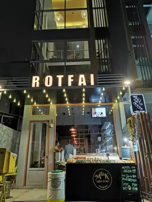 a restaurant with a sign that reads rotarian at Ratchada Hotel - ROTFAI in Bangkok