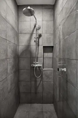 a bathroom with a shower with a shower head at Livinn91 Hotel in Bangkok