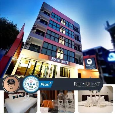 a building with a sign for a hotel at RoomQuest Sukhumvit36 BTS Thonglor in Bangkok