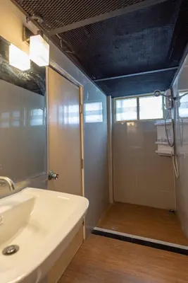a bathroom with a sink and a shower at @42 Residence in Bangkok