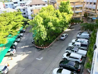 an aerial view of a parking lot with cars parked at Paholyothin Park Place in Bangkok
