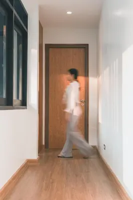 a man walking out of a door at 41Cafetel in Bangkok