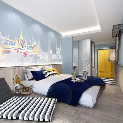 a bedroom with a large bed with a laptop on it at lyf Sukhumvit 8 Bangkok in Bangkok