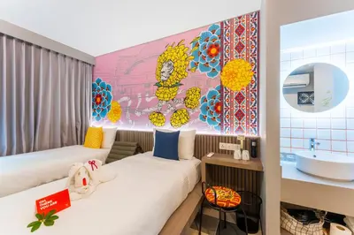 a hotel room with two beds and a sink at lyf Sukhumvit 8 Bangkok in Bangkok