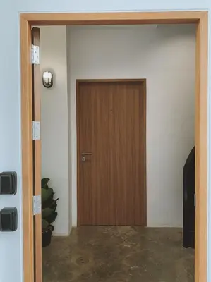 a wooden door in a room with at Marlowe-Tony's home in Bangkok