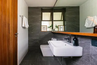 a bathroom with a white sink and a mirror at APT476 in Bangkok