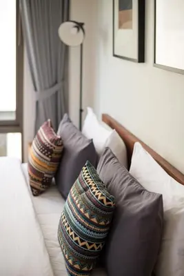 a group of pillows sitting on top of a couch at APT476 in Bangkok