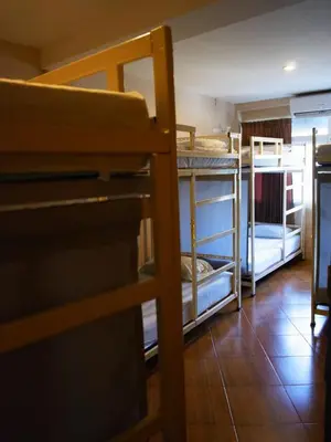 a room with several bunk beds in a room at VX The Fifty in Bangkok