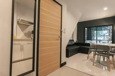 a sliding door in a kitchen with a dining room at S2 Silom Large room 4-6 guests Full kitchen WIFI in Bangkok