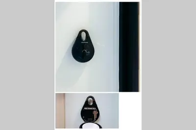 a white shelf with a black clock on it at S2 Silom Large room 4-6 guests Full kitchen WIFI in Bangkok
