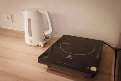 a blender sitting on top of a wooden floor at S2 Silom Large room 4-6 guests Full kitchen WIFI in Bangkok