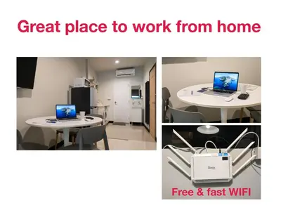 a room with a table with a laptop on it at S2 Silom Large room 4-6 guests Full kitchen WIFI in Bangkok
