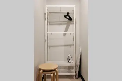 a white refrigerator with a table and a stool at S3 Silom26 · S3 Silom central, large room, full kitchen, WIFI, in Bangkok