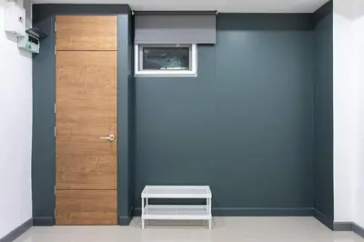 a door in a room with a bench next to it at P1 Silom Pan large room full kitchen WIFI 4-6pax in Bangkok