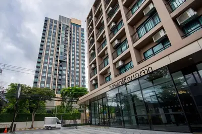 a building with a sign in front of it at Marsi Hotel @ Bangchak in Bangkok